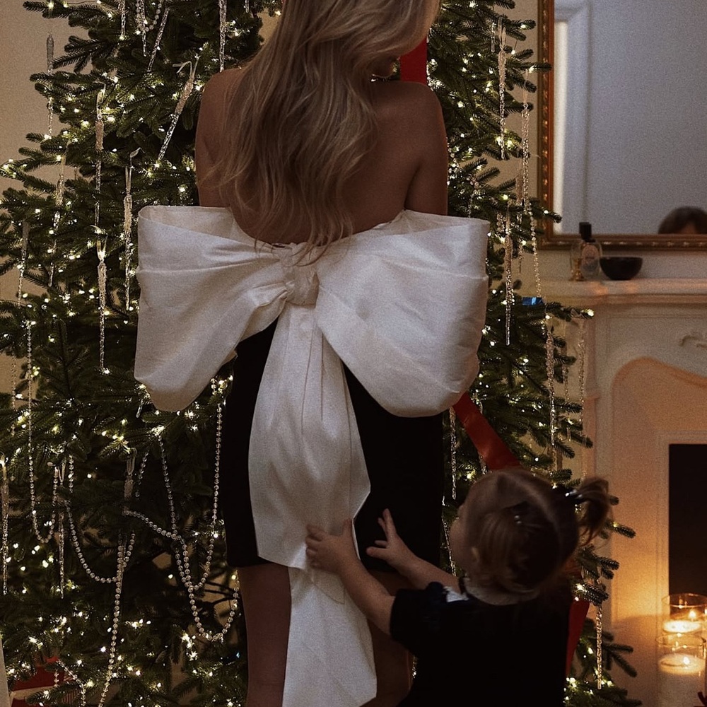 Elegant Black Dress with Large White Bow